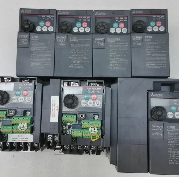 Mitsubishi Inverters FR-D740-0.75K-CHT 2 units without covers, FR-E740-0.75K-CHT 1 unit, FR-720-008-NA 2 units, FR-E720-0.1K 1 unit, FR-E720-0.1K-EA 1 unit. All functions are in good condition.